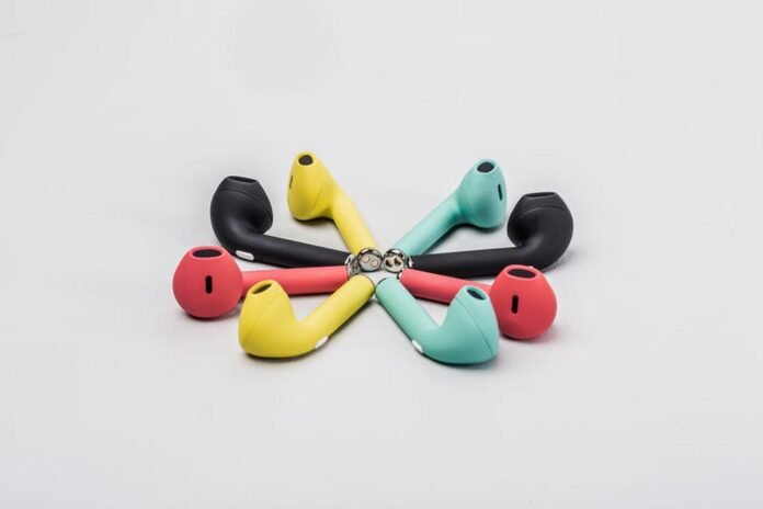 earbud circle - a group of four colorful earphones on a white background