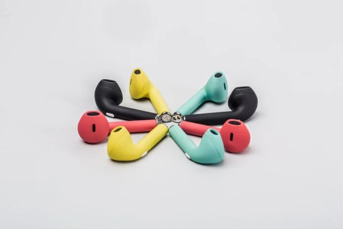 earbud circle - a group of four colorful earphones on a white background